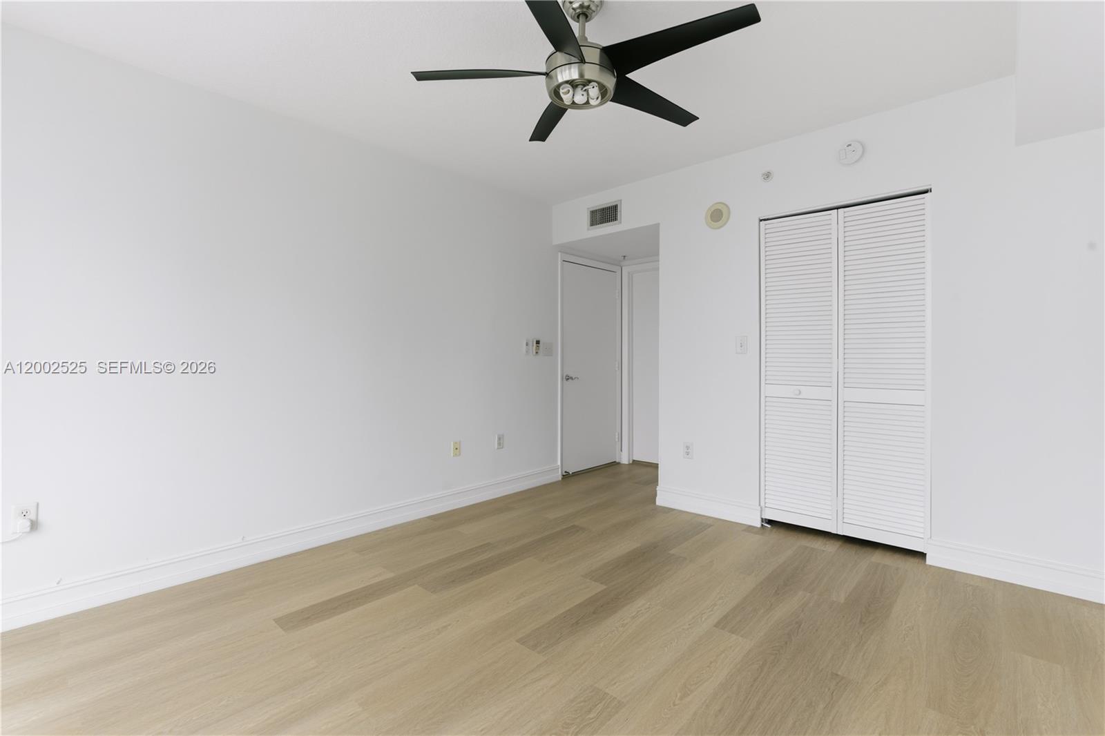 31 Southeast 5th Street, Unit 2301 Miami, FL 33131 - Photo 11 of 50 a view of a room with wooden floor