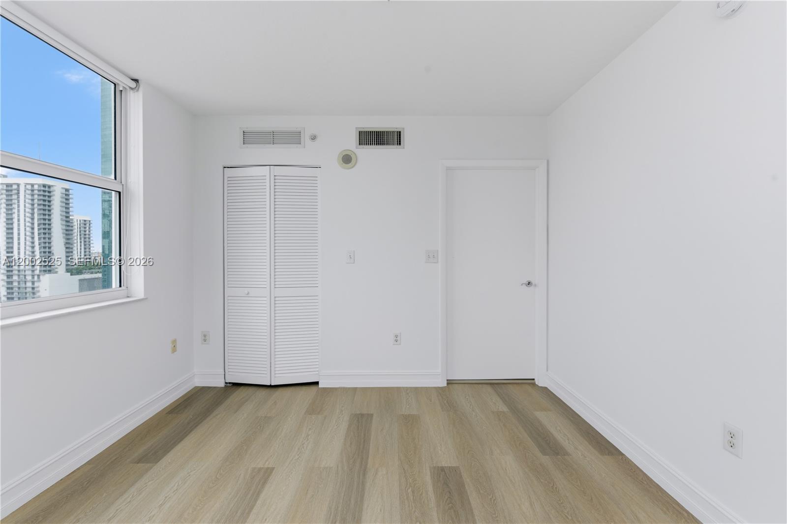 31 Southeast 5th Street, Unit 2301 Miami, FL 33131 - Photo 14 of 50 wooden floor in an empty room