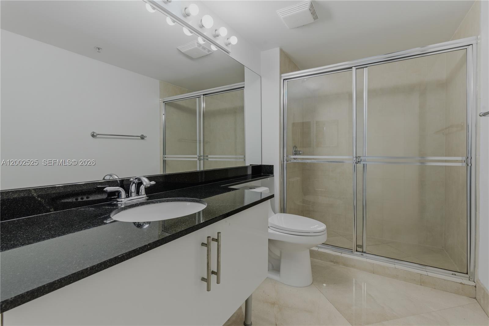 31 Southeast 5th Street, Unit 2301 Miami, FL 33131 - Photo 22 of 50 a bathroom with a sink and a toilet