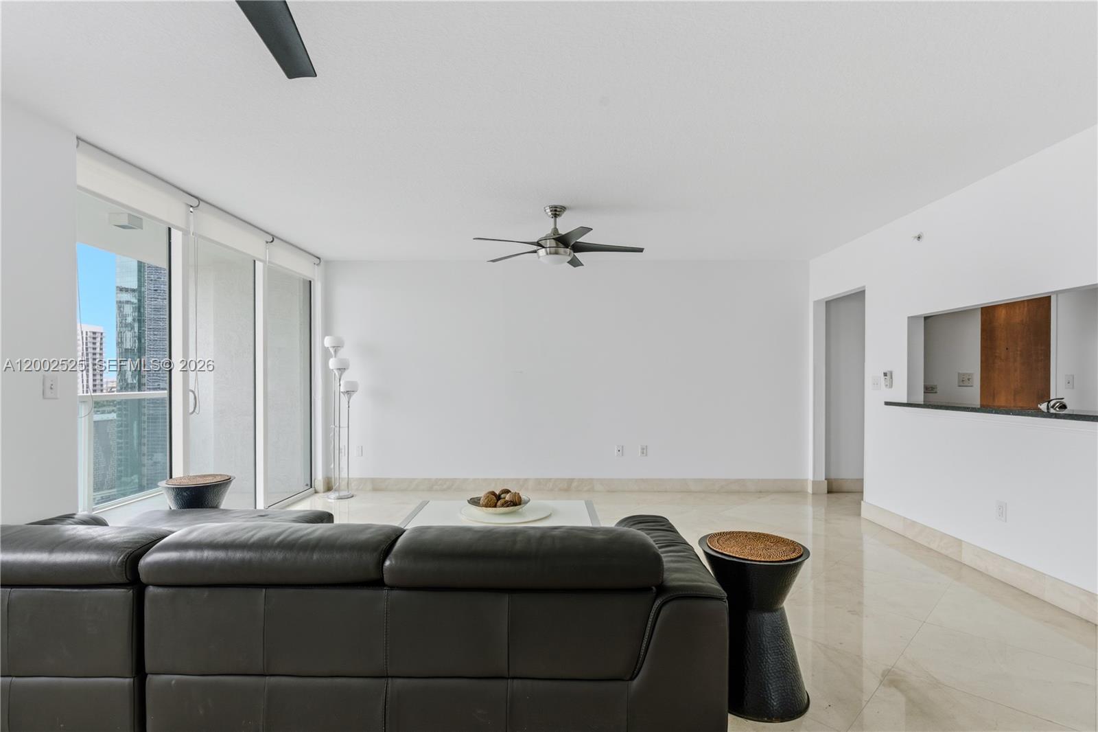 31 Southeast 5th Street, Unit 2301 Miami, FL 33131 - Photo 3 of 50 a living room with furniture and a window