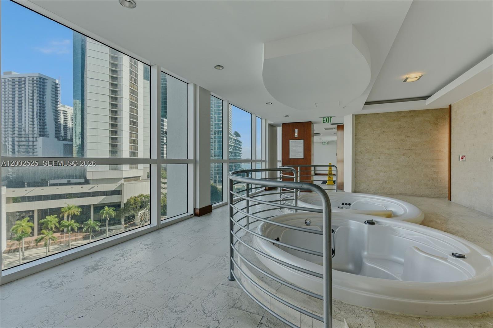 31 Southeast 5th Street, Unit 2301 Miami, FL 33131 - Photo 32 of 50 a bathroom with a bathtub and a sink