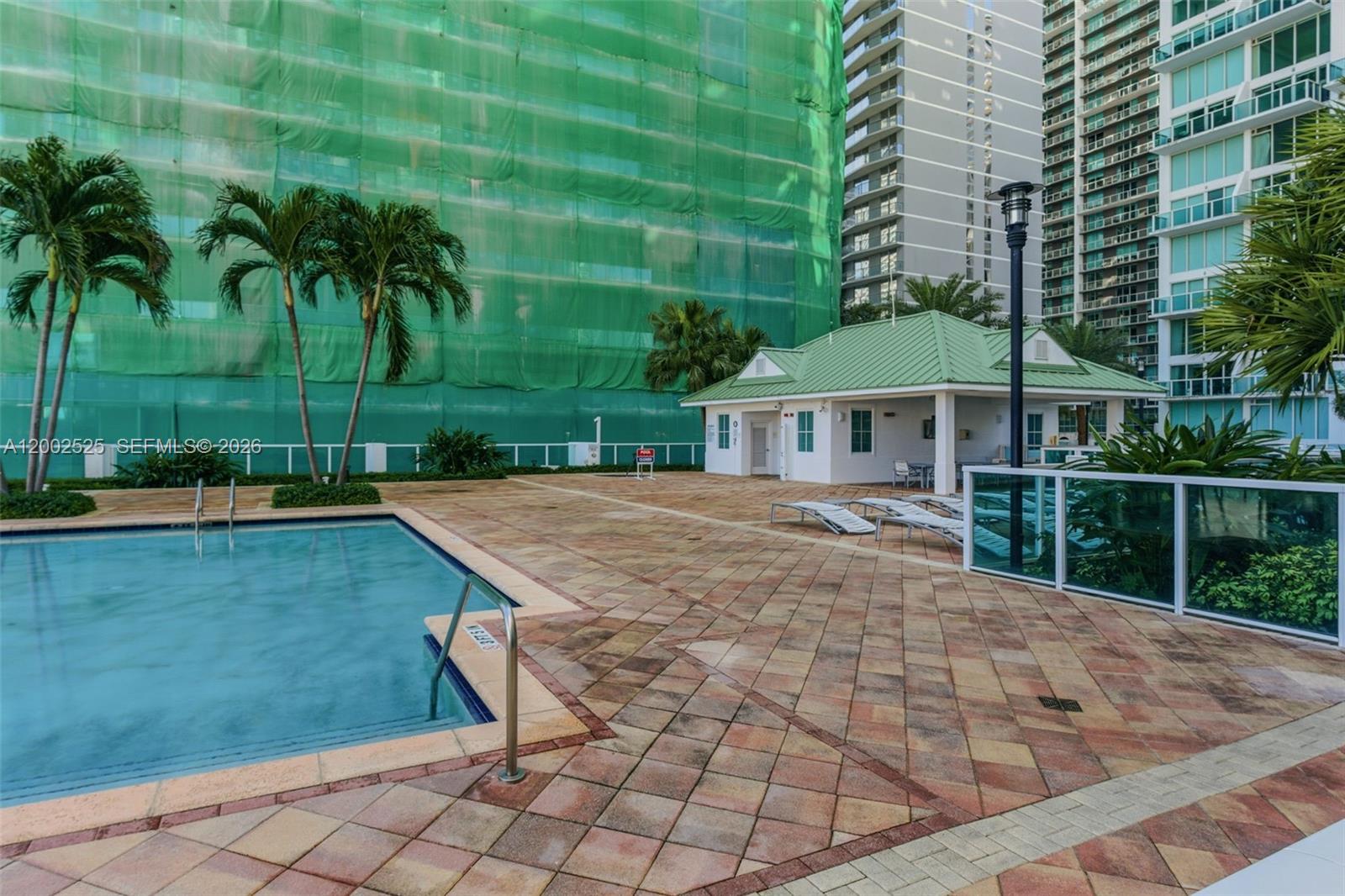31 Southeast 5th Street, Unit 2301 Miami, FL 33131 - Photo 35 of 50 a backyard of a house with palm trees