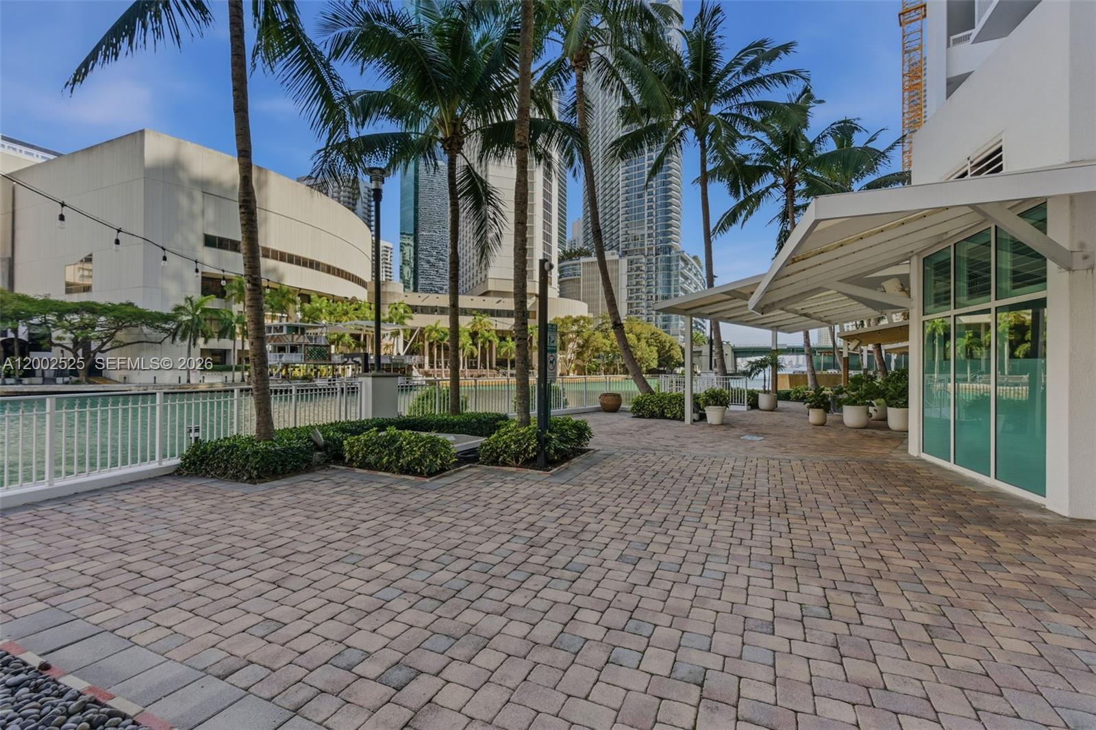 31 Southeast 5th Street, Unit 2301 Miami, FL 33131 - Photo 39 of 50 a view of a park with a table and chairs under an umbrella