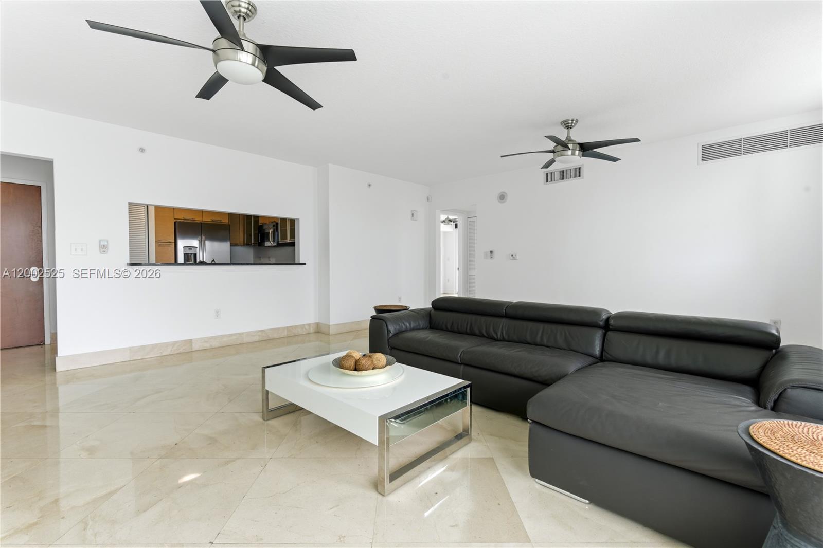 31 Southeast 5th Street, Unit 2301 Miami, FL 33131 - Photo 4 of 50 a living room with furniture and a wooden floor