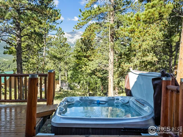 a wooden bench sitting in front of a building