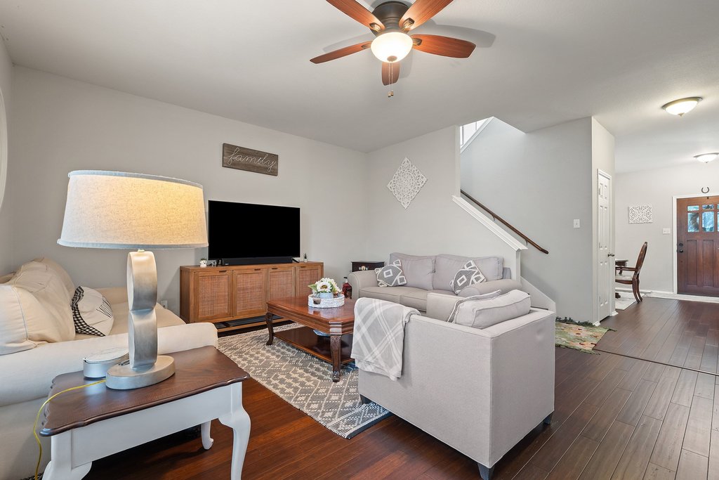 140 Wolfberry Path Buda, TX 78610 - Photo 6 of 35 a living room with furniture and a flat screen tv
