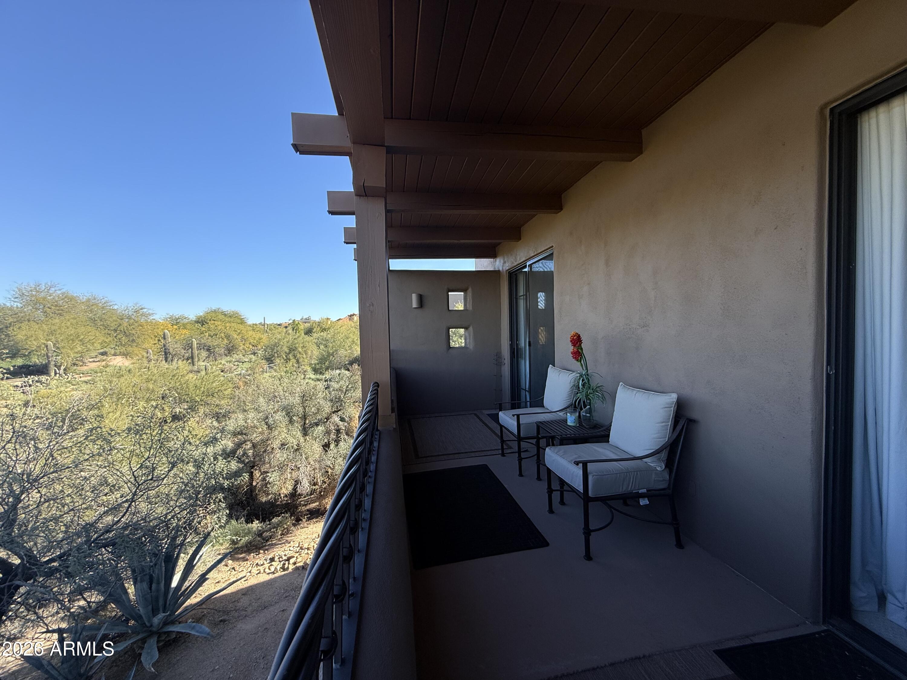 36601 North Mule Train Road, Unit D18 Carefree, AZ 85377 - Photo 13 of 57 a view of a balcony with furniture