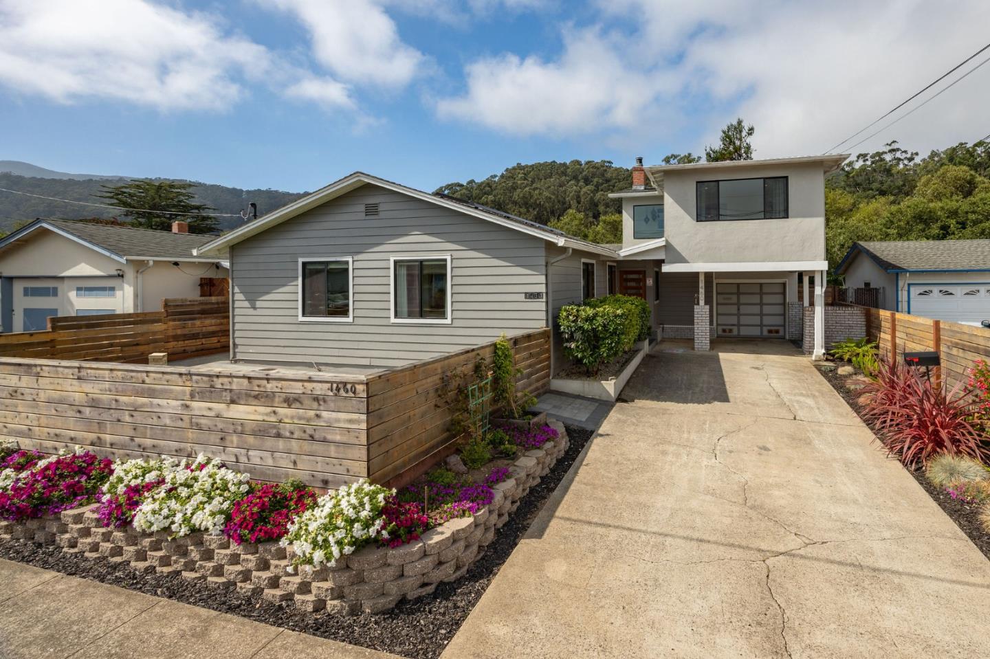1460 Flores Drive Pacifica, CA 94044 - Photo 2 of 69 a front view of a house with a yard