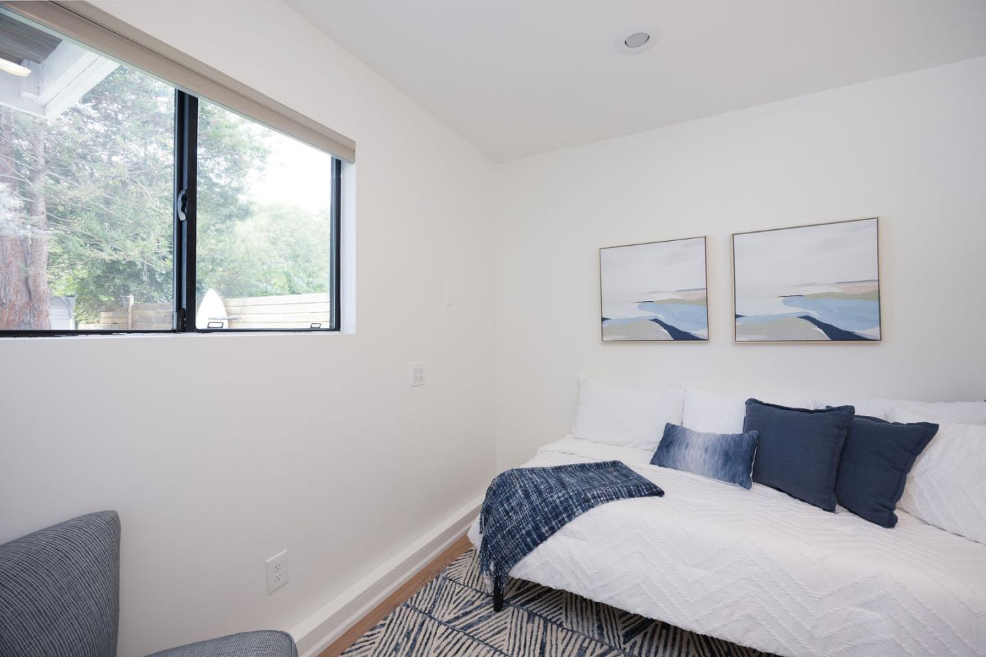 1460 Flores Drive Pacifica, CA 94044 - Photo 26 of 69 a bedroom with a bed and window