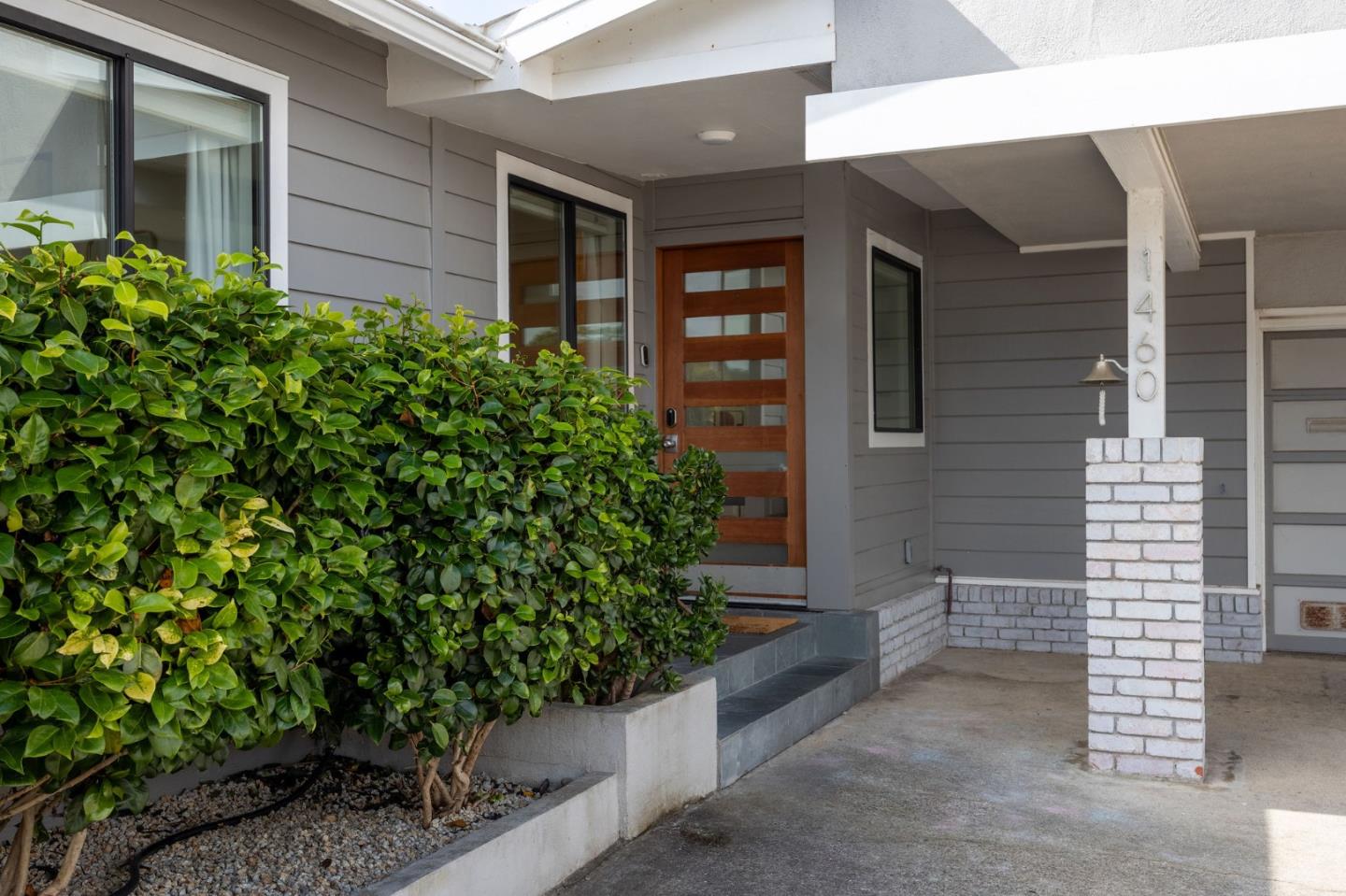 1460 Flores Drive Pacifica, CA 94044 - Photo 3 of 69 a view of a brick house with potted plants