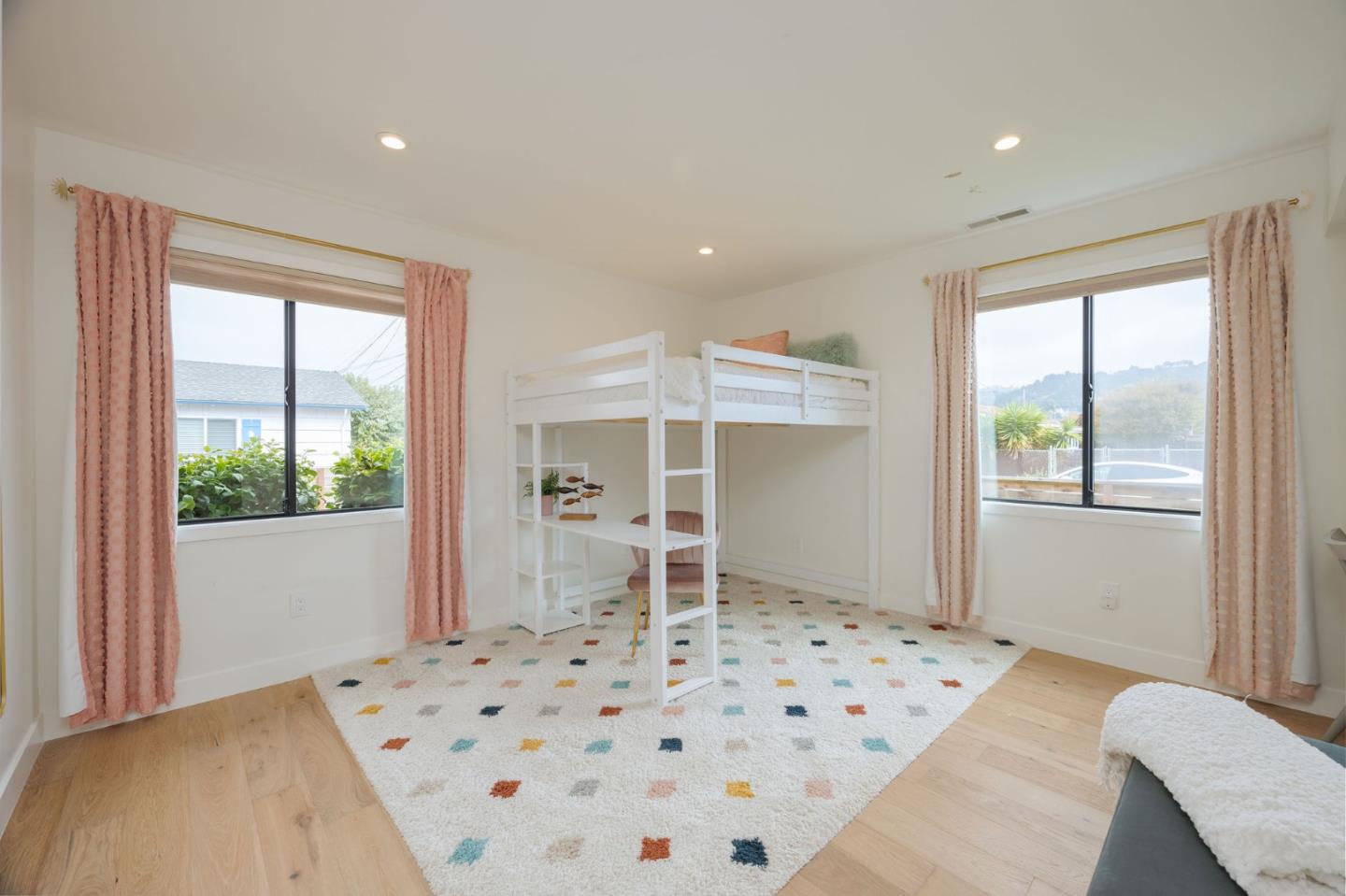 1460 Flores Drive Pacifica, CA 94044 - Photo 31 of 69 a bedroom with a bed and a window