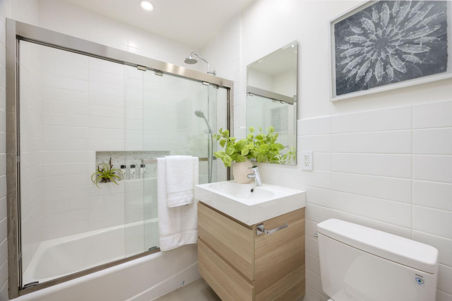1460 Flores Drive Pacifica, CA 94044 - Photo 35 of 69 a bathroom with a sink a toilet and shower