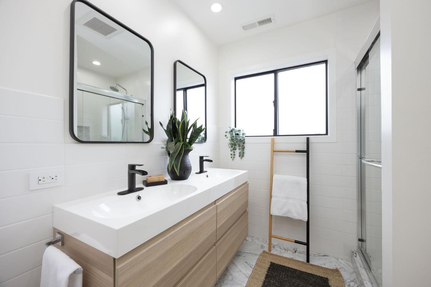 1460 Flores Drive Pacifica, CA 94044 - Photo 40 of 69 a bathroom with a sink a mirror and window