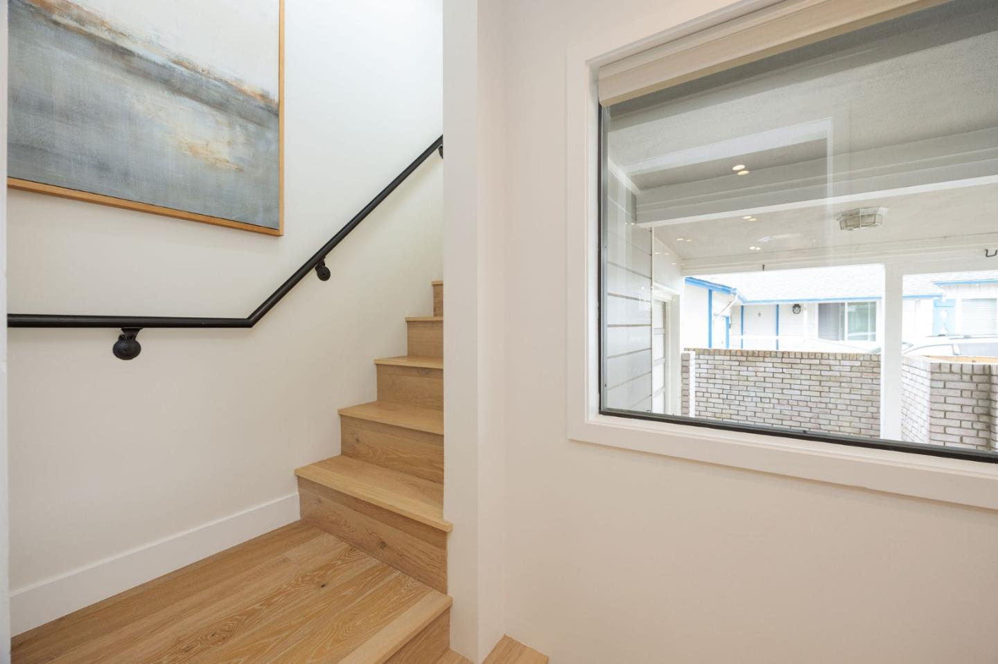 1460 Flores Drive Pacifica, CA 94044 - Photo 5 of 69 a view of an entryway with wooden floor