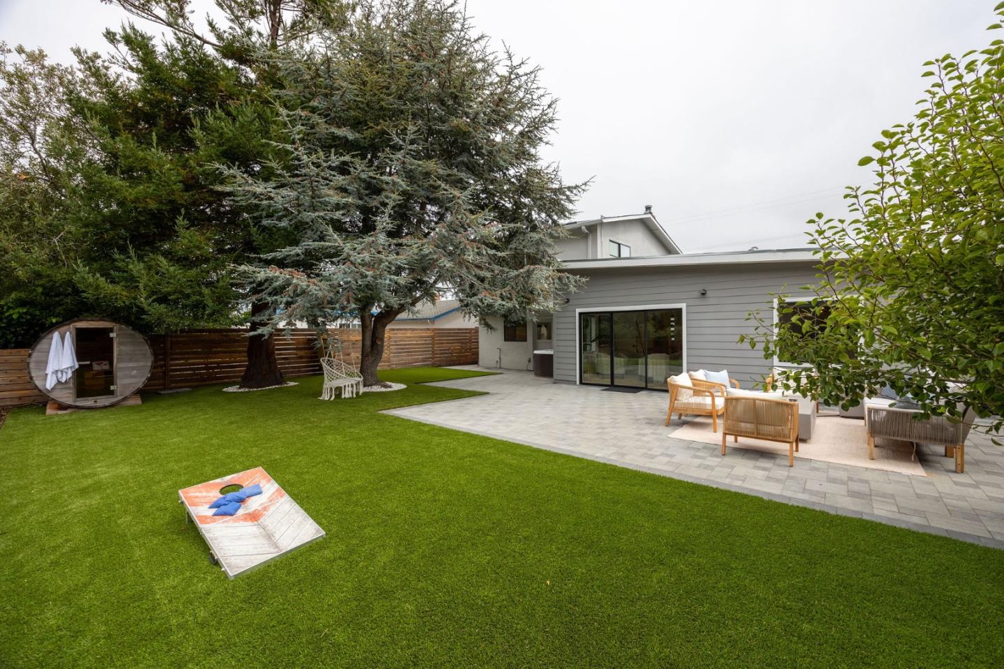 1460 Flores Drive Pacifica, CA 94044 - Photo 53 of 69 a backyard of a house with table and sofas