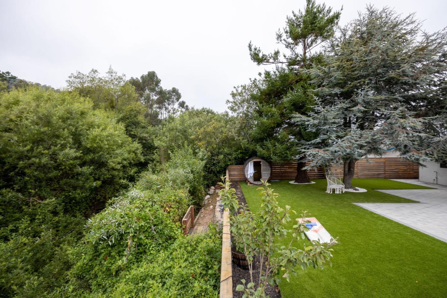 1460 Flores Drive Pacifica, CA 94044 - Photo 55 of 69 a view of a house with a yard table and chairs