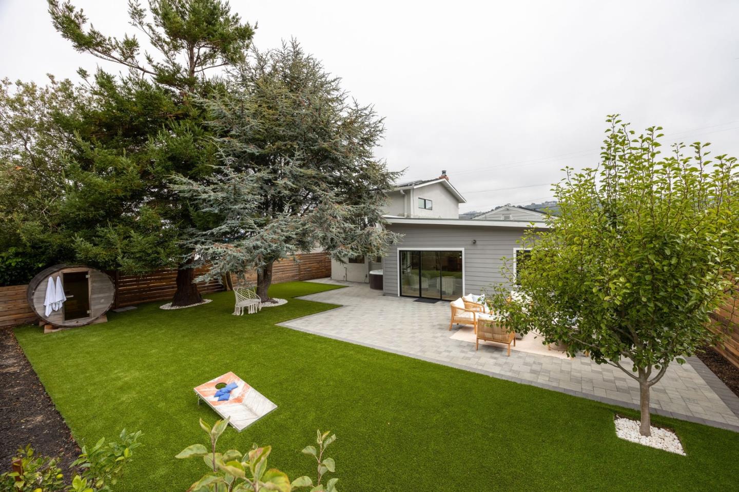 1460 Flores Drive Pacifica, CA 94044 - Photo 56 of 69 a front view of a house with garden and chairs