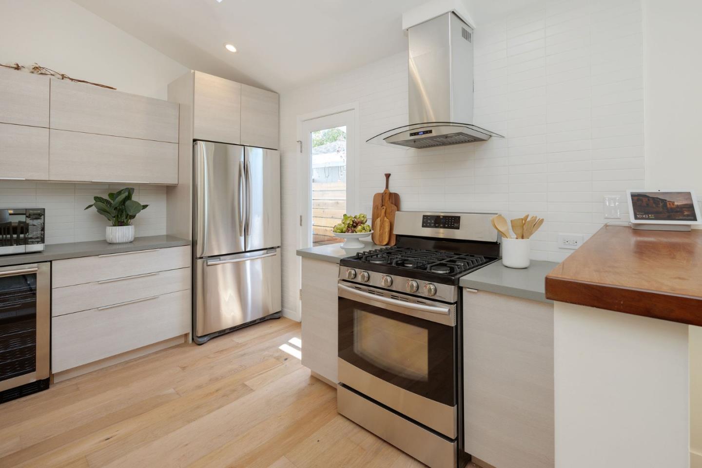 1460 Flores Drive Pacifica, CA 94044 - Photo 9 of 69 a kitchen with granite countertop a stove and a refrigerator