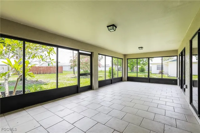 a view of an empty room with windows