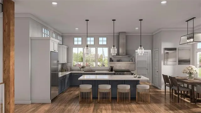 a kitchen with kitchen island granite countertop a table and chairs