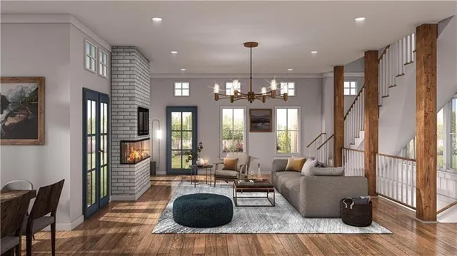 a living room with furniture and a chandelier