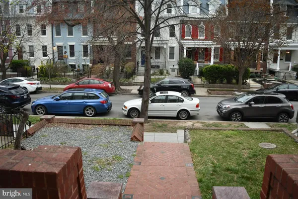 a view of a street with cars