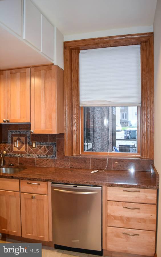 39 Bryant Street Northwest Washington, DC 20001 - Photo 7 of 17 a kitchen with granite countertop cabinets stainless steel appliances a sink and a window