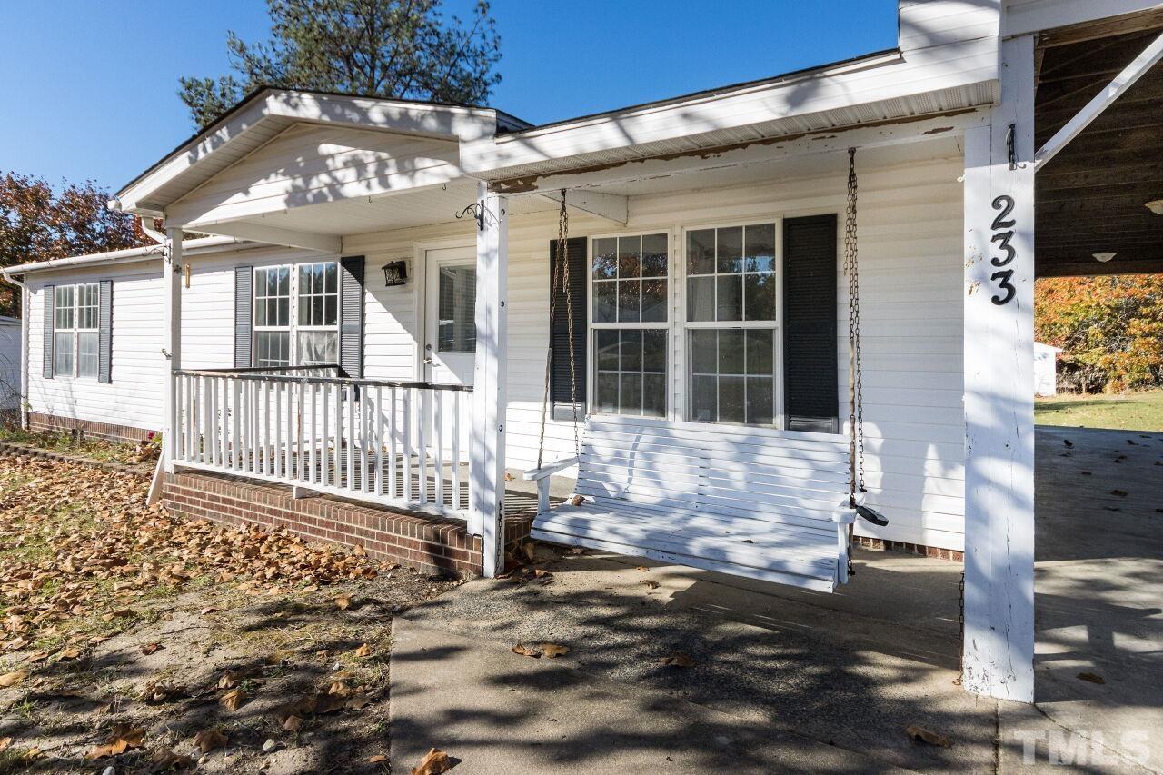 233 Eisler Drive Lillington, NC 27546 - Photo 3 of 29 a front view of a house with a yard