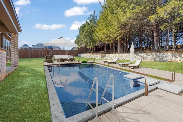 a view of a swimming pool with a lounge chairs