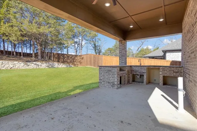 a view of a swimming pool with an outdoor seating and a yard