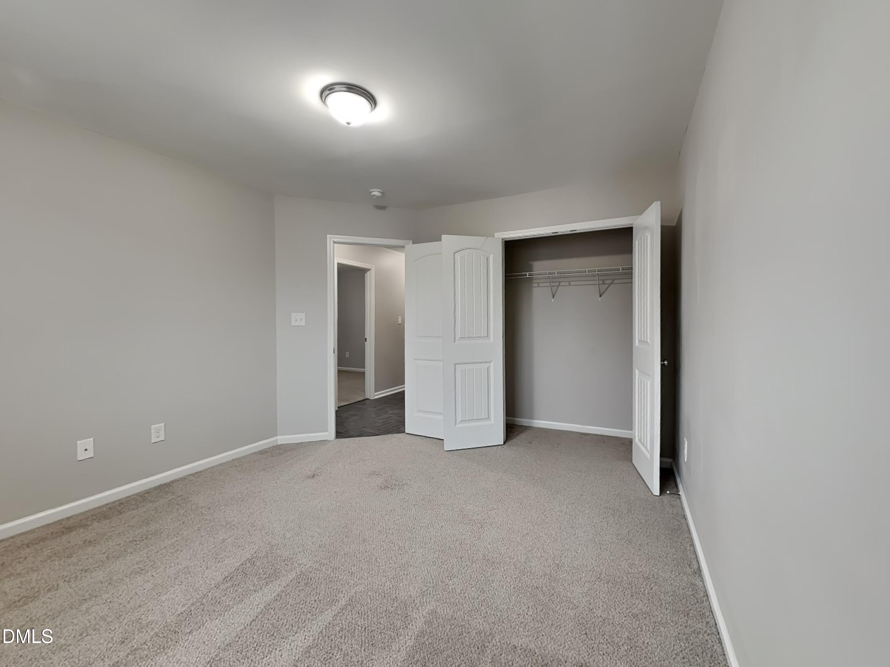 295 New Castle Lane Spring Lake, NC 28390 - Photo 11 of 17 a view of an empty room and a window