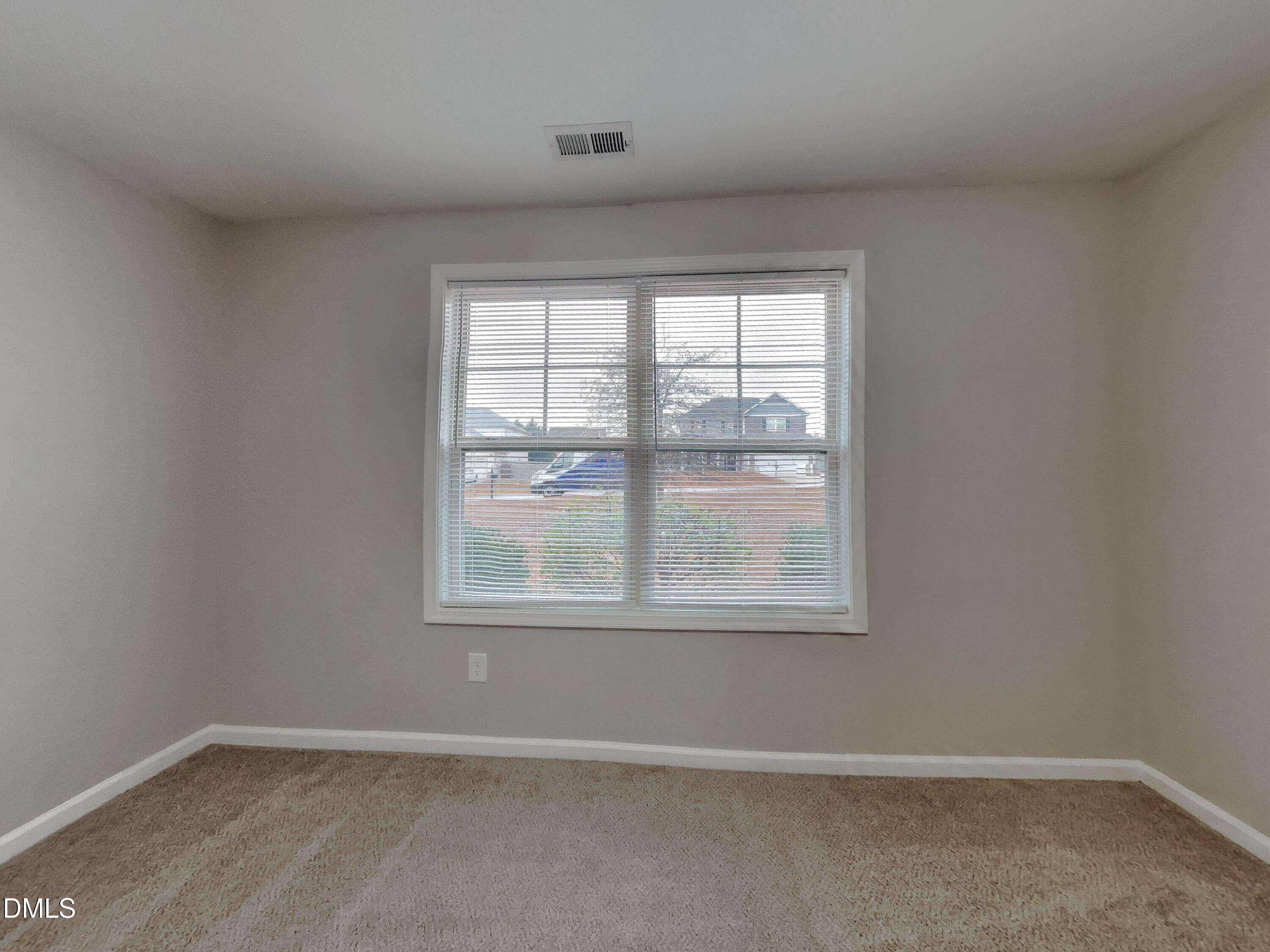 295 New Castle Lane Spring Lake, NC 28390 - Photo 12 of 17 an empty room with a window