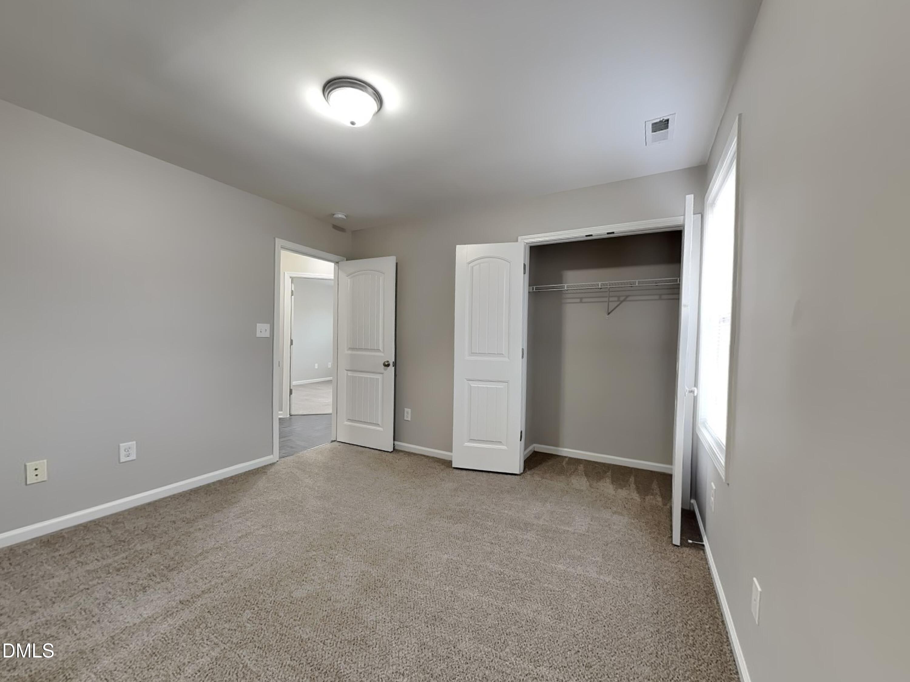 295 New Castle Lane Spring Lake, NC 28390 - Photo 14 of 17 a view of an empty room