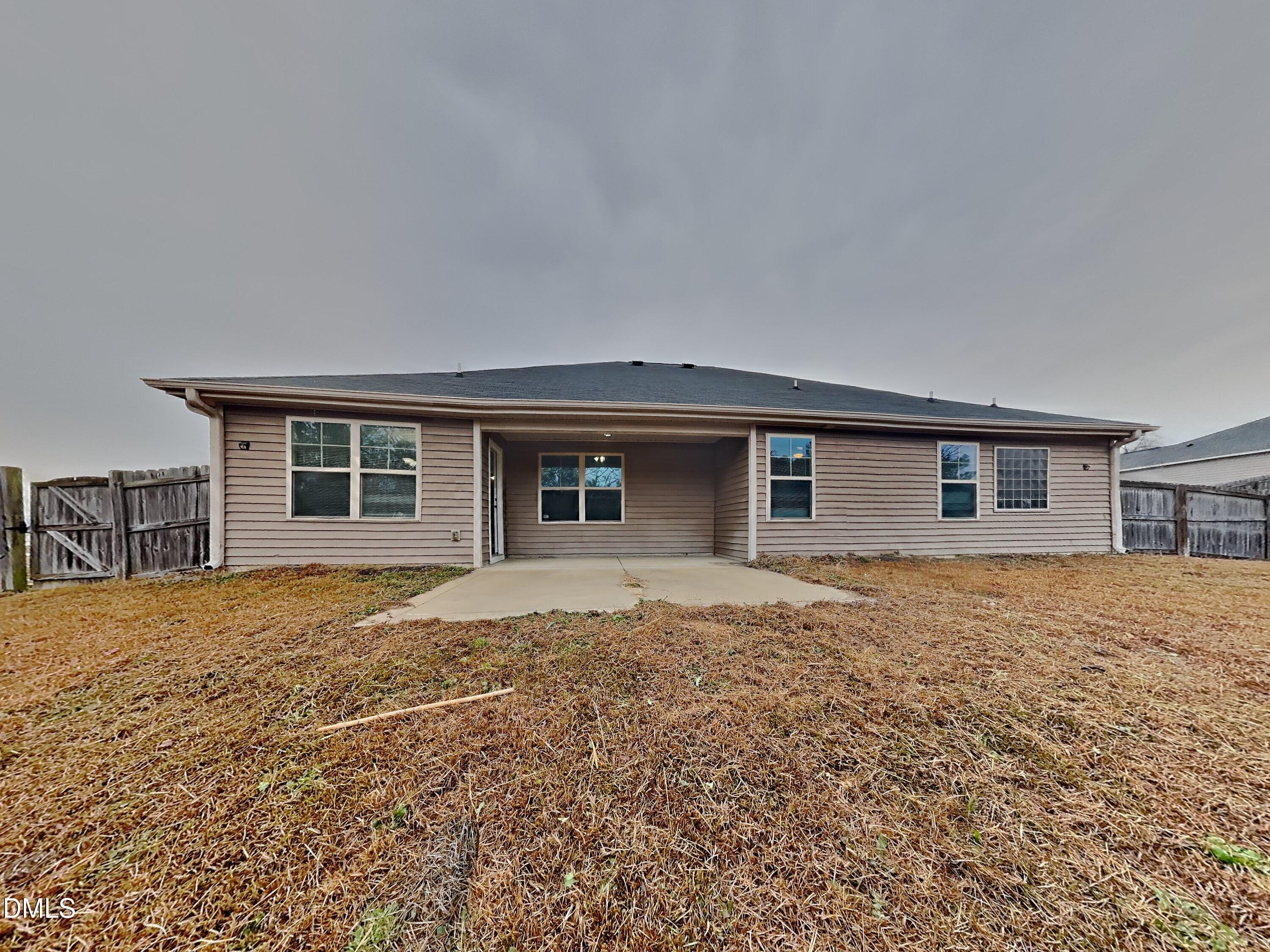 295 New Castle Lane Spring Lake, NC 28390 - Photo 17 of 17 a house view with a backyard space