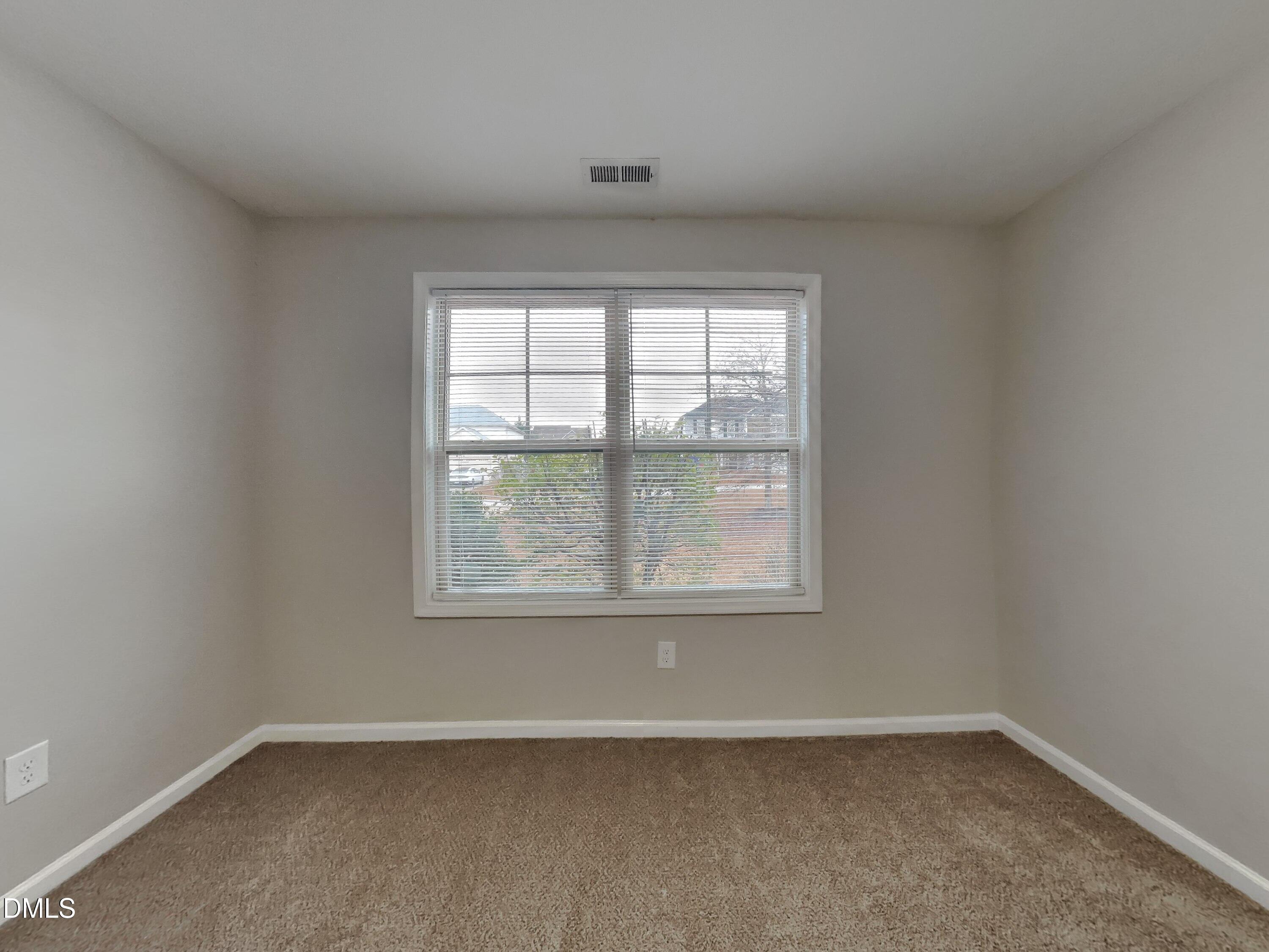 295 New Castle Lane Spring Lake, NC 28390 - Photo 10 of 17 an empty room with a window