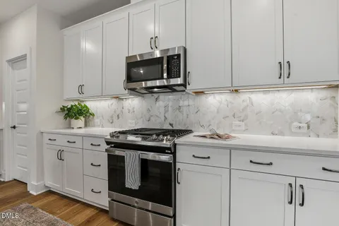 a kitchen with refrigerator a sink and dishwasher