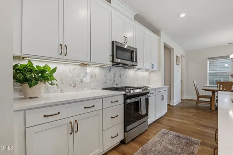 a large kitchen with lots of counter space and a sink