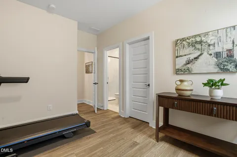 a view of living room with furniture and wooden floor