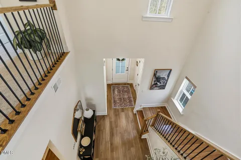 a living room with furniture rug and wooden floor