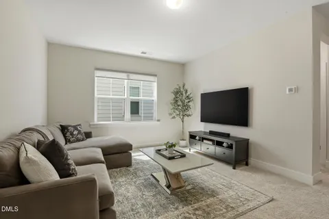 a spacious bedroom with a bed and glass door