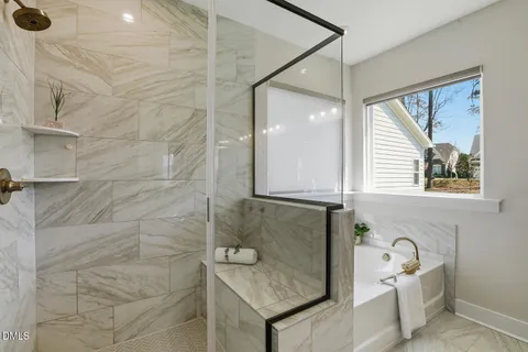 a bedroom with a bed and painting on the wall