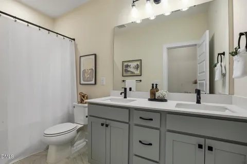 a bedroom with bed and a window