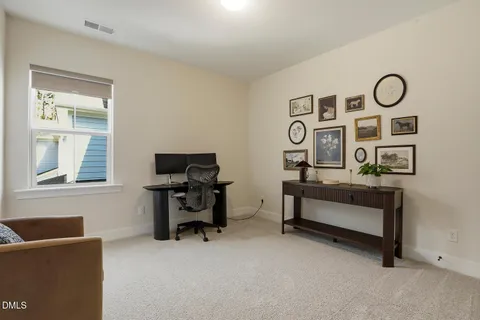a bathroom with a washing machine and a window