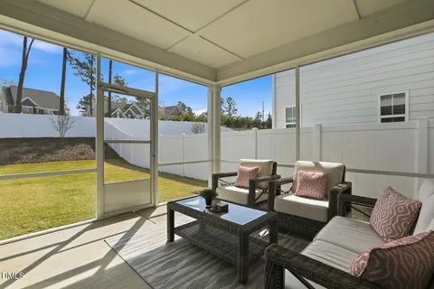 a view of a house with backyard and porch