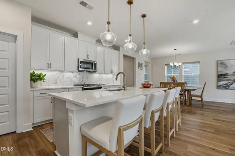a kitchen with cabinets and stainless steel appliances