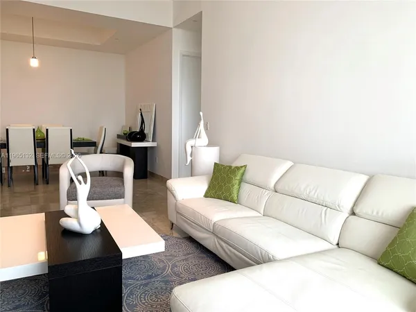 a living room with furniture and a couch