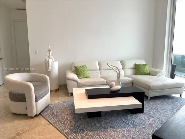 a living room with furniture and a couch