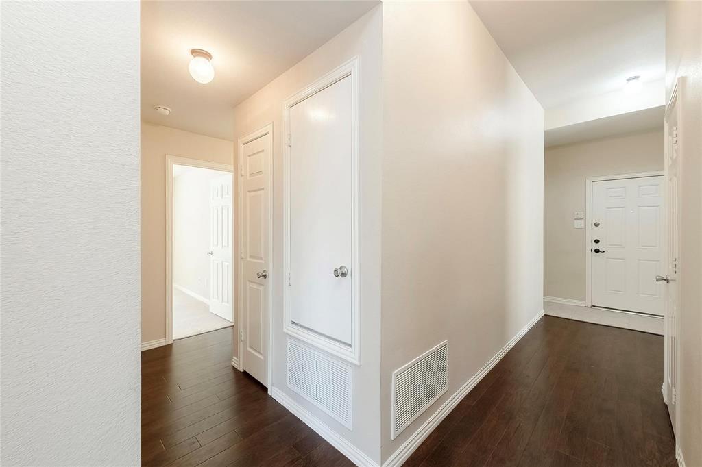 2716 Dawn Spring Drive Little Elm, TX 75068 - Photo 11 of 23 a view of a hallway with wooden floor