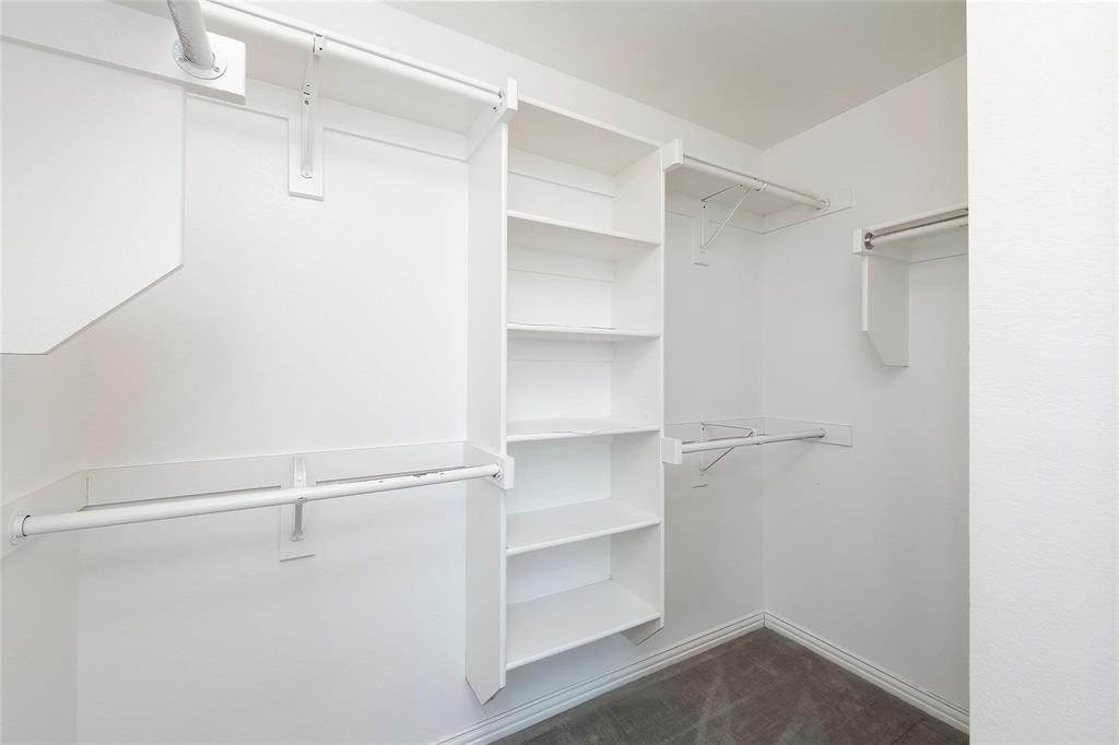 2716 Dawn Spring Drive Little Elm, TX 75068 - Photo 17 of 23 a view of walk in closet with empty racks