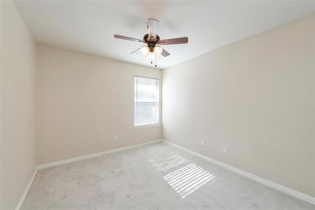 2716 Dawn Spring Drive Little Elm, TX 75068 - Photo 20 of 23 an empty room with windows and fan